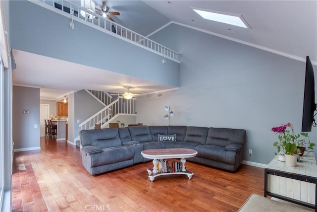 64 Seacrest Ct, Long Beach, CA 90803 - living room with a ceiling fan, stairway, wood finished floors, ornamental molding, and high vaulted ceiling