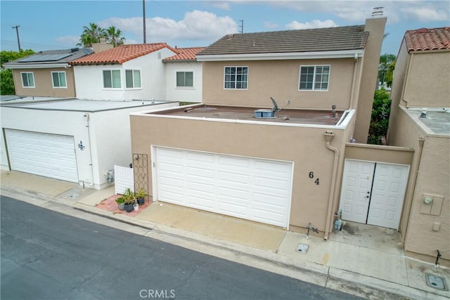 64 Seacrest Ct, Long Beach, CA 90803 - back of property with stucco siding and a chimney