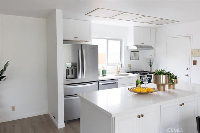 910 Kittery Way, Pinole, CA 94564 - kitchen featuring appliances with stainless steel finishes, a sink, extractor fan, white cabinets, and light countertops