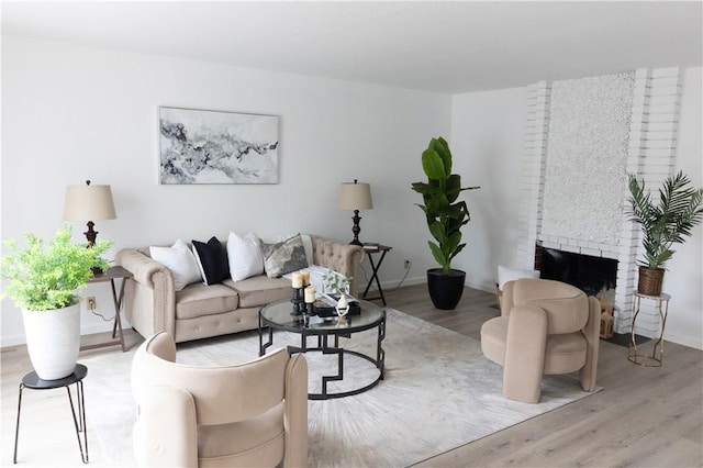 910 Kittery Way, Pinole, CA 94564 - living area featuring wood finished floors, baseboards, and a brick fireplace