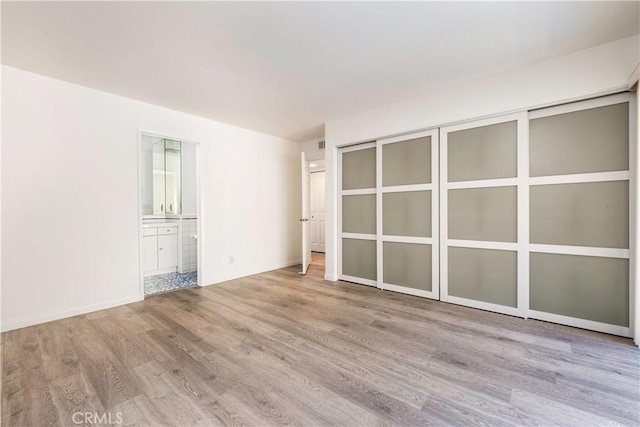 2051 Orizaba Ave Unit 8, Signal Hill, CA 90755 - spare room featuring wood finished floors and baseboards