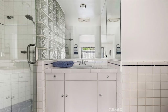 2051 Orizaba Ave Unit 8, Signal Hill, CA 90755 - bathroom featuring tile walls, a stall shower, and vanity