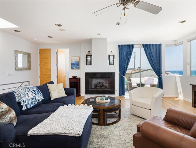 209 41st, Manhattan Beach, CA 90266 - living area with ceiling fan, light wood finished floors, a glass covered fireplace, and recessed lighting
