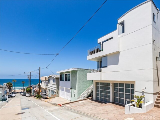 209 41st, Manhattan Beach, CA 90266 - view of concrete road with street lighting, a water view, sidewalks, and curbs