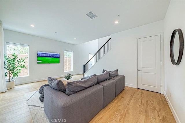 20754 W Bur Oak Cir, Porter Ranch, CA 91326 - living room with light wood-type flooring, stairs, and recessed lighting