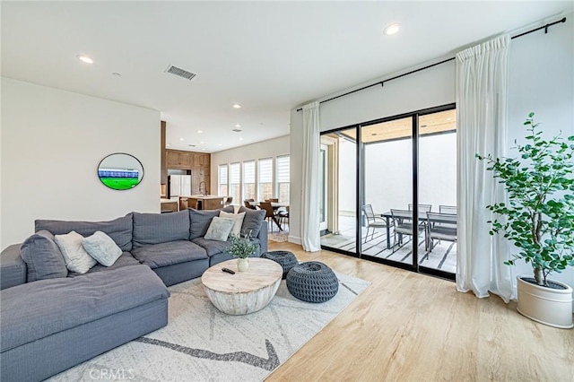 20754 W Bur Oak Cir, Porter Ranch, CA 91326 - living room featuring light wood-type flooring and recessed lighting