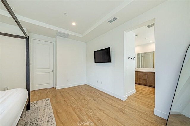 20754 W Bur Oak Cir, Porter Ranch, CA 91326 - unfurnished bedroom featuring light wood-type flooring, recessed lighting, and connected bathroom
