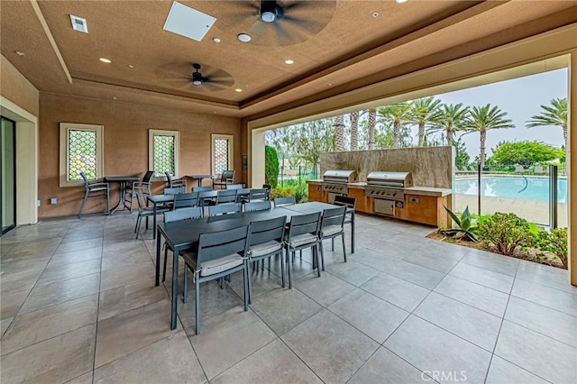 20754 W Bur Oak Cir, Porter Ranch, CA 91326 - view of patio / terrace featuring exterior kitchen, outdoor dining area, and ceiling fan