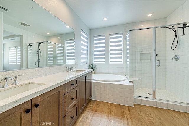 20754 W Bur Oak Cir, Porter Ranch, CA 91326 - bathroom with plenty of natural light, wood finished floors, a stall shower, and a bath