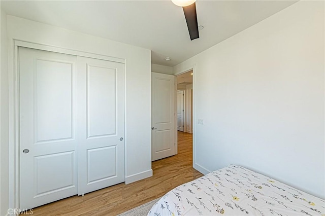 20754 W Bur Oak Cir, Porter Ranch, CA 91326 - unfurnished bedroom with light wood-style floors, a closet, and a ceiling fan