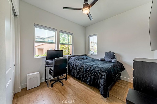 20754 W Bur Oak Cir, Porter Ranch, CA 91326 - bedroom with light wood finished floors and ceiling fan