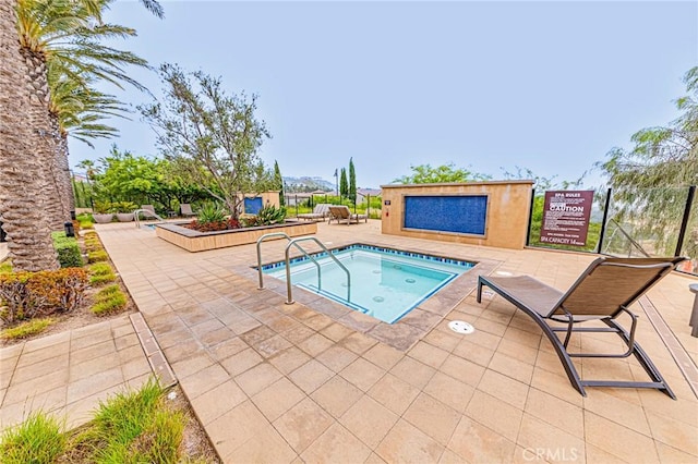 20754 W Bur Oak Cir, Porter Ranch, CA 91326 - view of swimming pool featuring a community hot tub and a patio