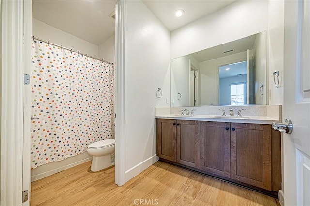 20754 W Bur Oak Cir, Porter Ranch, CA 91326 - bathroom with wood finished floors, double vanity, and a shower with shower curtain