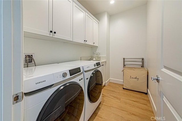 20754 W Bur Oak Cir, Porter Ranch, CA 91326 - washroom featuring separate washer and dryer, cabinet space, light wood-style floors, and recessed lighting