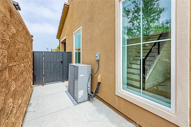20754 W Bur Oak Cir, Porter Ranch, CA 91326 - view of side of property featuring a gate, stucco siding, and a patio area