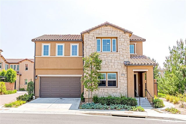 20754 W Bur Oak Cir, Porter Ranch, CA 91326 - view of front of property with a tile roof, stone siding, concrete driveway, and stucco siding