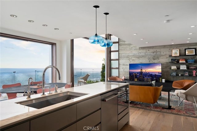 2517 Iris Way, Laguna Beach, CA 92651 - kitchen with open floor plan, light wood finished floors, stainless steel dishwasher, a water view, and a wall of windows