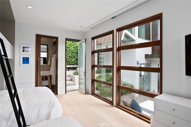 2517 Iris Way, Laguna Beach, CA 92651 - bedroom with light wood-style flooring, connected bathroom, and recessed lighting