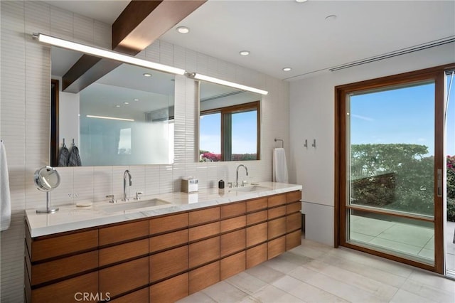 2517 Iris Way, Laguna Beach, CA 92651 - full bathroom featuring double vanity, healthy amount of natural light, backsplash, and tile walls