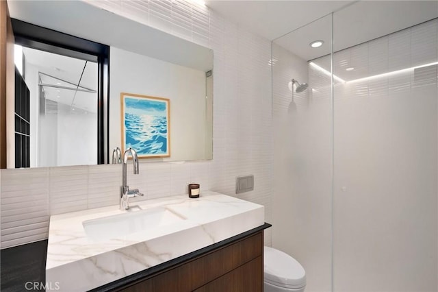 2517 Iris Way, Laguna Beach, CA 92651 - full bathroom with tile walls, vanity, a walk in shower, decorative backsplash, and recessed lighting