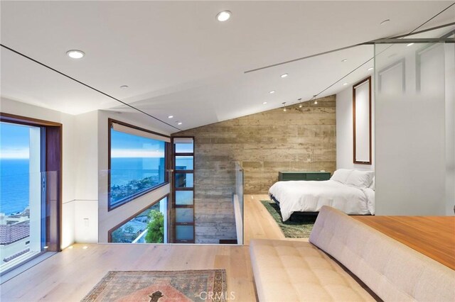 2517 Iris Way, Laguna Beach, CA 92651 - bedroom featuring lofted ceiling, wooden walls, wood finished floors, and recessed lighting
