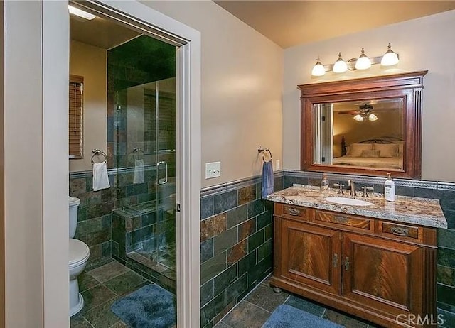 1709 Lassen Way, Pine Mountain Club, CA 93222 - bathroom with tile walls, vanity, a stall shower, wainscoting, and tile patterned flooring