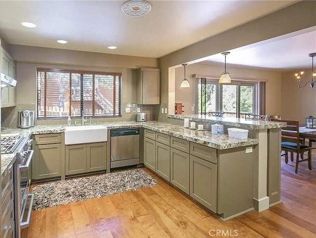 1709 Lassen Way, Pine Mountain Club, CA 93222 - kitchen with stainless steel appliances, light wood-type flooring, decorative backsplash, and recessed lighting