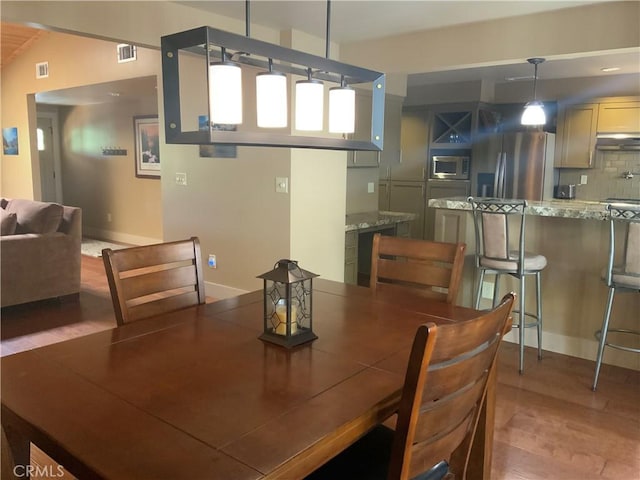 1709 Lassen Way, Pine Mountain Club, CA 93222 - dining space featuring wood finished floors and baseboards