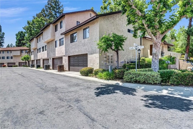 2243 Calle Taxco, West Covina, CA 91792 - view of building exterior featuring a garage and central AC unit