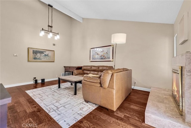 2243 Calle Taxco, West Covina, CA 91792 - living area featuring a premium fireplace, dark wood-style floors, baseboards, high vaulted ceiling, and beamed ceiling