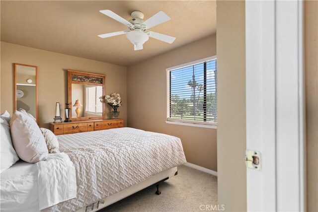 60545 Montecito Dr Unit 5, Palm Springs, CA 92264 - carpeted bedroom featuring baseboards and ceiling fan