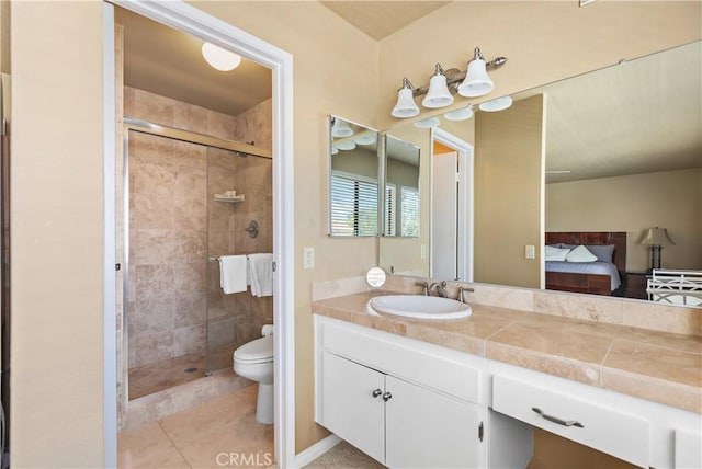 60545 Montecito Dr Unit 5, Palm Springs, CA 92264 - ensuite bathroom with a shower stall, vanity, and tile patterned flooring