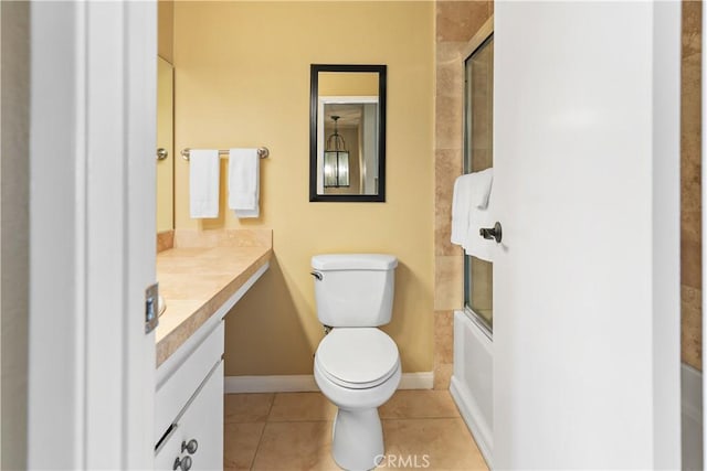 60545 Montecito Dr Unit 5, Palm Springs, CA 92264 - bathroom featuring vanity, tile patterned floors, and combined bath / shower with glass door