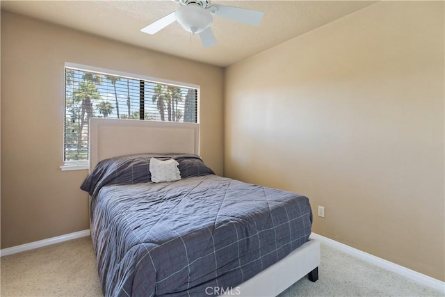 60545 Montecito Dr Unit 5, Palm Springs, CA 92264 - carpeted bedroom featuring baseboards and a ceiling fan