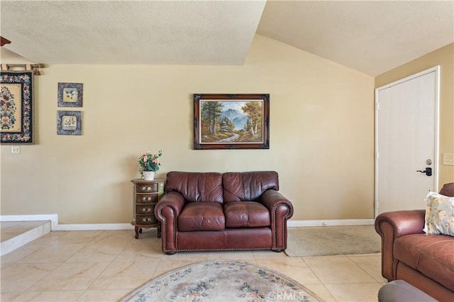 60545 Montecito Dr Unit 5, Palm Springs, CA 92264 - living room featuring lofted ceiling and a textured ceiling