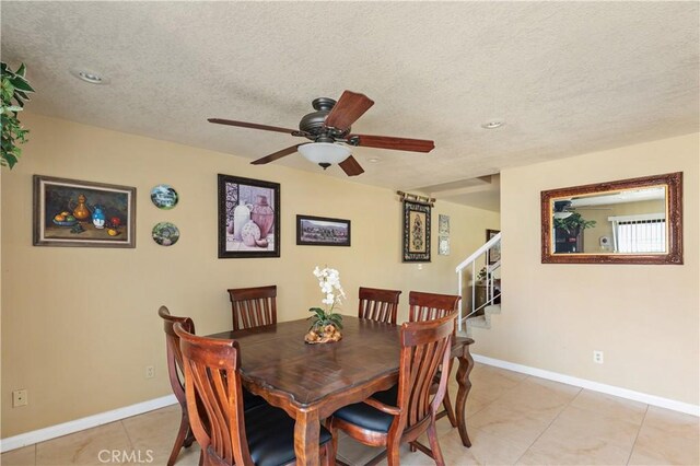60545 Montecito Dr Unit 5, Palm Springs, CA 92264 - dining area with stairs, ceiling fan, light tile patterned flooring, a textured ceiling, and recessed lighting