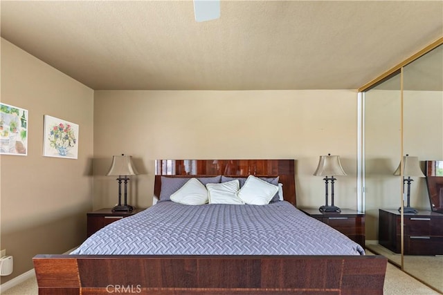 60545 Montecito Dr Unit 5, Palm Springs, CA 92264 - bedroom featuring light carpet and a closet