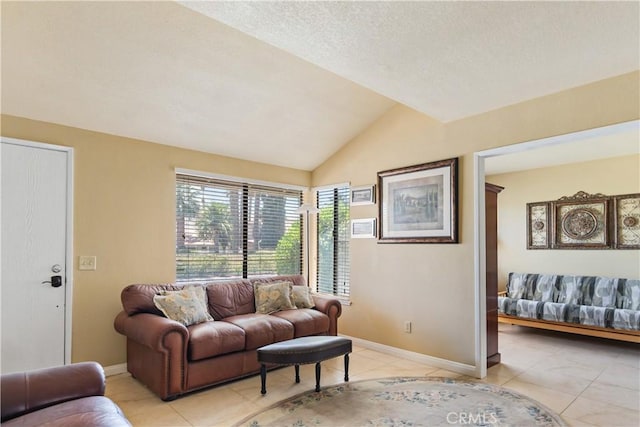 60545 Montecito Dr Unit 5, Palm Springs, CA 92264 - living area featuring light tile patterned floors and lofted ceiling