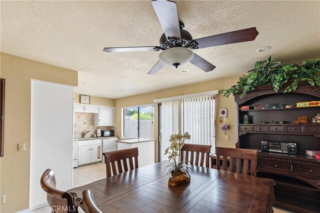 60545 Montecito Dr Unit 5, Palm Springs, CA 92264 - dining room with a textured ceiling and a ceiling fan