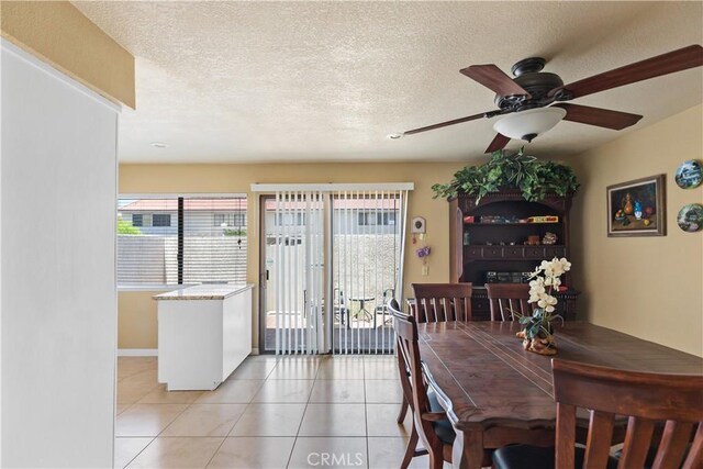 60545 Montecito Dr Unit 5, Palm Springs, CA 92264 - dining space featuring plenty of natural light, light tile patterned floors, ceiling fan, and a textured ceiling