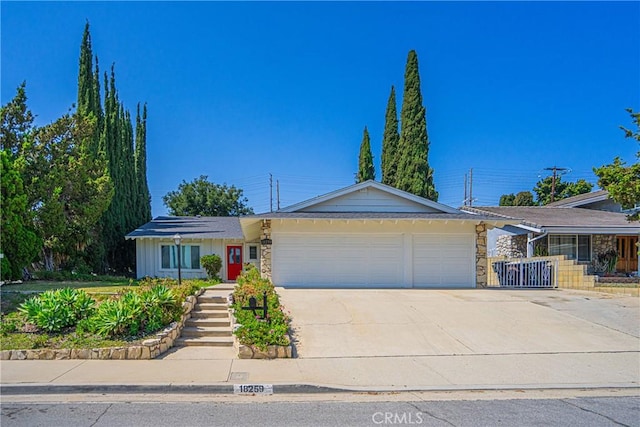 18259 Midbury St, Brea, CA 92821 - ranch-style house with an attached garage, concrete driveway, and stone siding