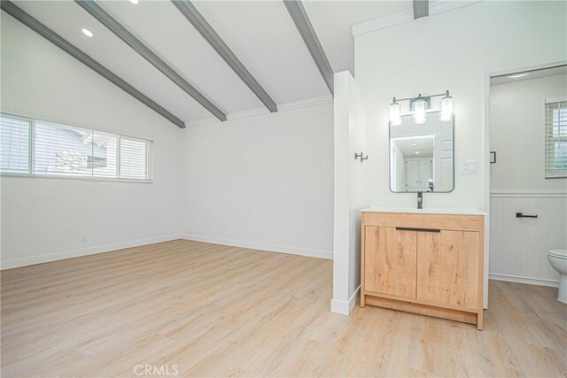 18259 Midbury St, Brea, CA 92821 - bathroom with vanity, wood finished floors, healthy amount of natural light, and a wainscoted wall