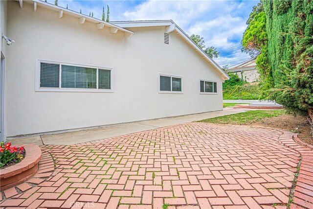 18259 Midbury St, Brea, CA 92821 - rear view of house with a patio area and stucco siding