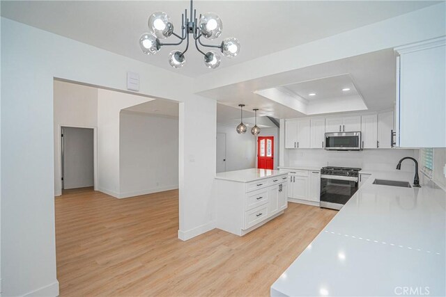 18259 Midbury St, Brea, CA 92821 - kitchen featuring appliances with stainless steel finishes, light wood finished floors, light countertops, white cabinets, and recessed lighting
