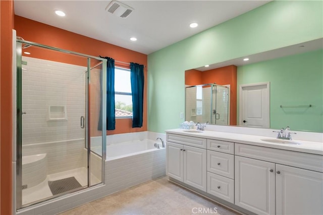 34901 Limecrest Pl, Murrieta, CA 92563 - bathroom with a shower stall, double vanity, a bath, recessed lighting, and tile patterned flooring
