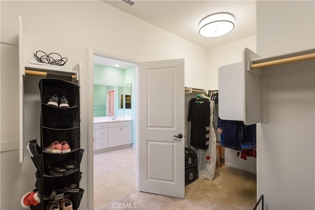 34901 Limecrest Pl, Murrieta, CA 92563 - walk in closet featuring light carpet and lofted ceiling