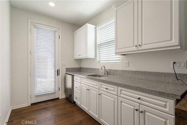 34901 Limecrest Pl, Murrieta, CA 92563 - kitchen featuring white cabinets, dark wood finished floors, healthy amount of natural light, light stone countertops, and recessed lighting