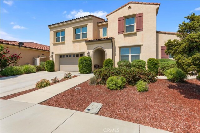 34901 Limecrest Pl, Murrieta, CA 92563 - mediterranean / spanish home with concrete driveway, a garage, stucco siding, and a tile roof