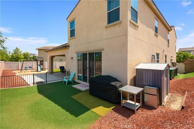34901 Limecrest Pl, Murrieta, CA 92563 - back of house with a playground and stucco siding