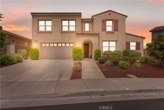 34901 Limecrest Pl, Murrieta, CA 92563 - mediterranean / spanish home with stucco siding, driveway, an attached garage, and a tiled roof